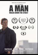 A Man Walks Down The Street